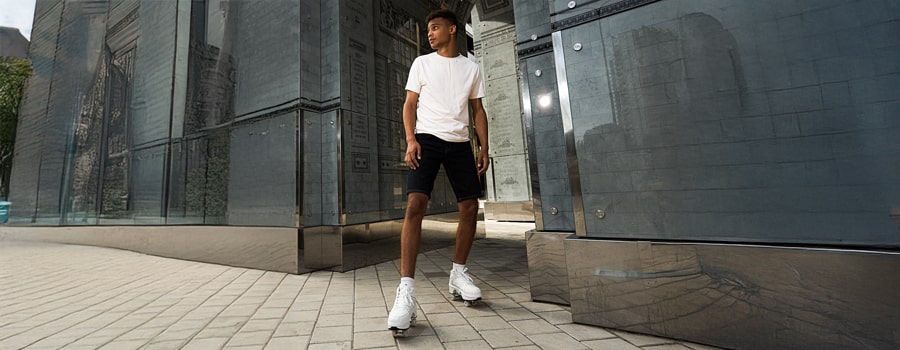 Young man in roller shoes