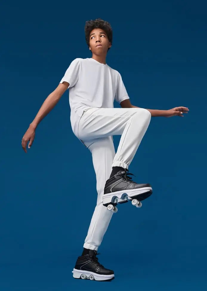 Stylish men in Liekick transformable roller shoes, striking a dynamic pose against a deep blue background, embodying freedom and innovation in movement.