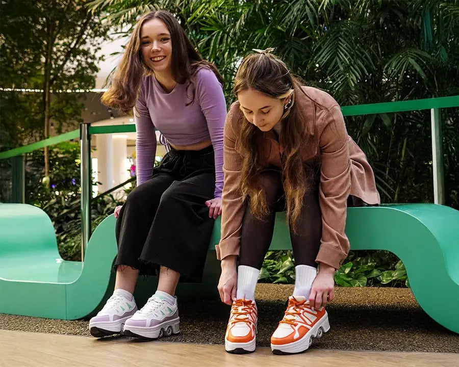 Two young girls in roller shoes